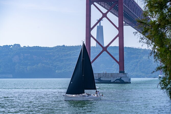 Private sailboat tour in Lisbon - Stop 2: Ponte 25 de Abril Under the Bridge