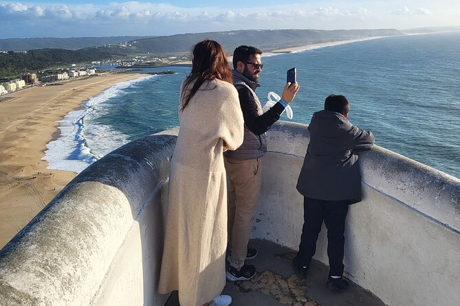 Private Tour to Portugal's SilverCoast - Nazaré, Óbidos & Fátima - Nazaré fishing traditions, long sandy beach views, and the Sítio headland