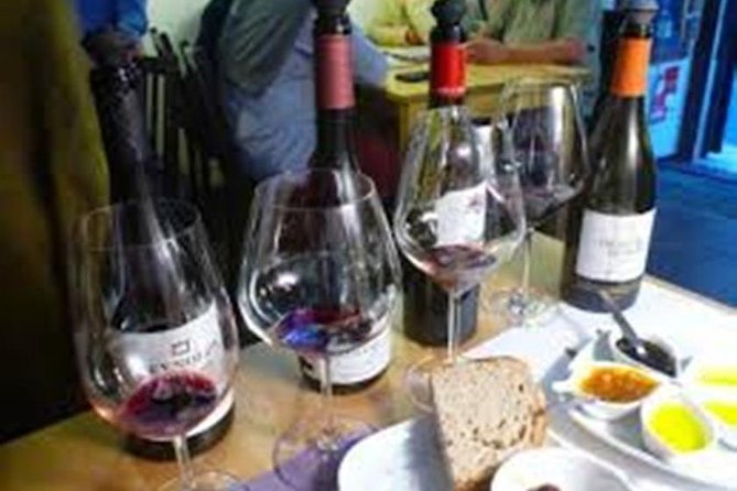 Setúbal Private Full Day Wine Tour with Tasting and Lunch at the Beach - Bacalhôa in Azeitão: hexagonal buildings, olive trees, and short tastings