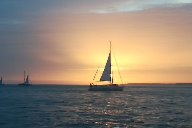 Small Group Sailboat Sunset Tour in Lisbon with a Drink - What you get for $42.69: drink, snacks, and river-level Lisbon