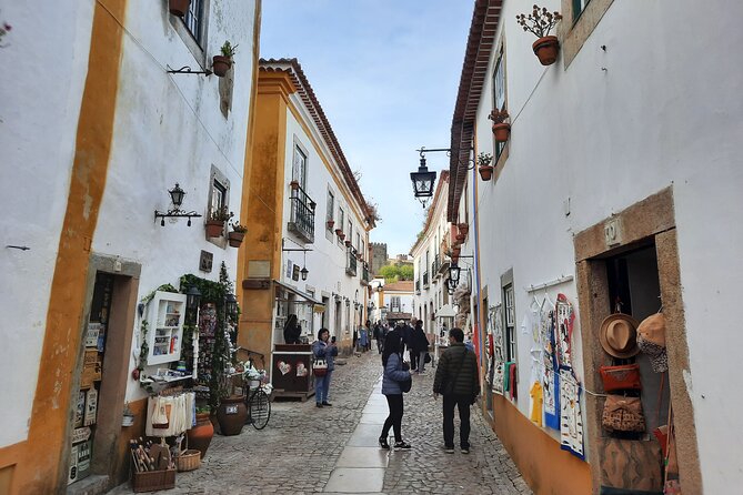 Small group tour to Nazaré and Obidos from Lisbon - Stop 5: Óbidos’ ramparts, cobblestones, and a chocolate-cup ginjinha
