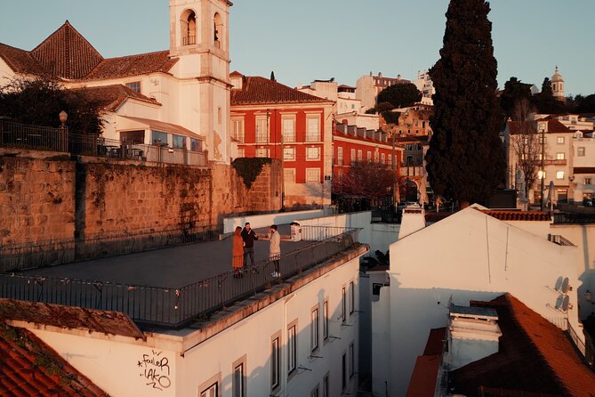 Sunrise Walking Tour: Lisbon Before the Crowds - Wavy stone patterns and fountains, then the triumphal arch
