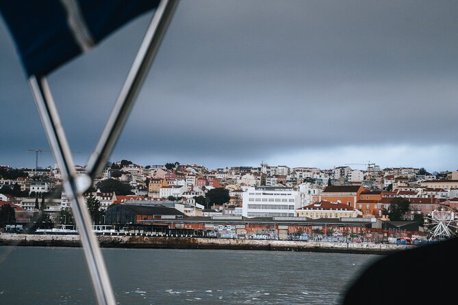 Sunset Sailboat Tejo River Tour 2h - Under Lisbon’s iconic landmark: why the view feels faster from water