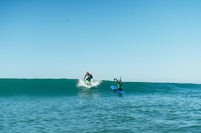 Surf Lesson in Lisbon - The surf experience - Tarquinio beach setup: wetsuit, board, lockers, and the walk to sand