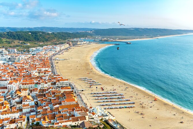Transfer Tour Lisbon/Porto with 2 stops options Óbidos, Nazaré, Fátima, Coimbra - Stop 1: Óbidos Village—castle walls and church-heavy old streets