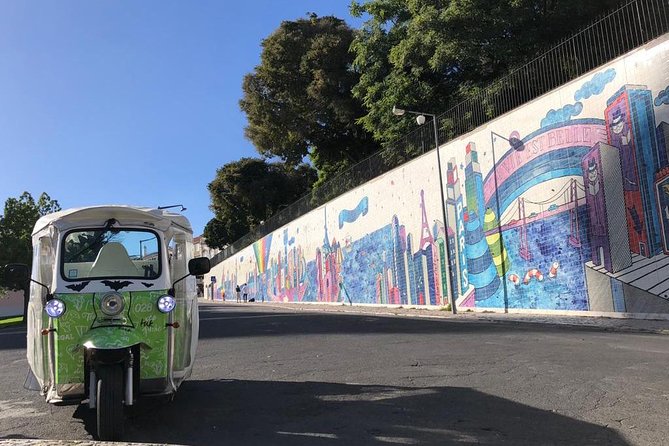 Tuk Tuk Lisbon: Exploring Urban Art - Vhils in Travessa das Merceeiras: Alexandre Farto and carved faces